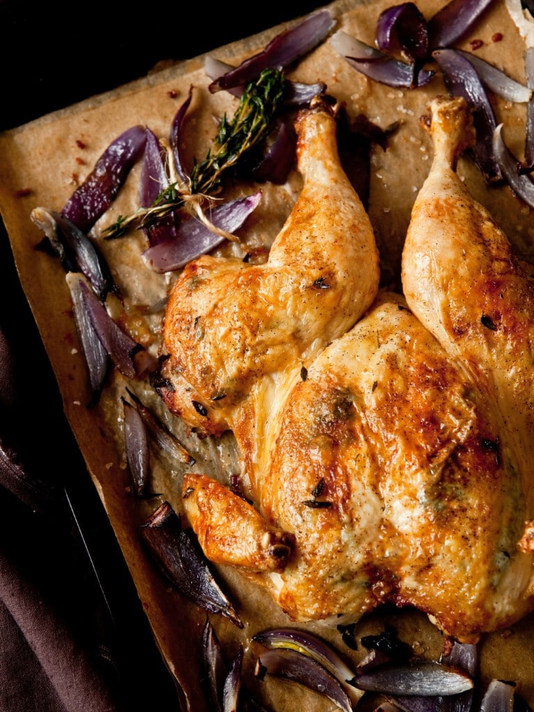Roast Chicken is my 'I don’t want to cook' meal. It’s fast and requires very little hands-on preparation. I butterfly it, brush it with ghee, add some onions and another vegetable or two, season with salt and pepper, put it in the oven and walk away.