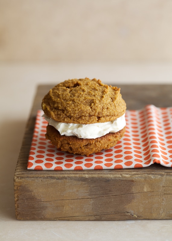 These pumpkin whoopie pies make for a great spongy cookie on their own - the cookies almost taste a bit like muffin tops. Two spiced cookies are paired together with whipped butter, cream cheese and maple syrup to sweeten. They are quite the treat.
