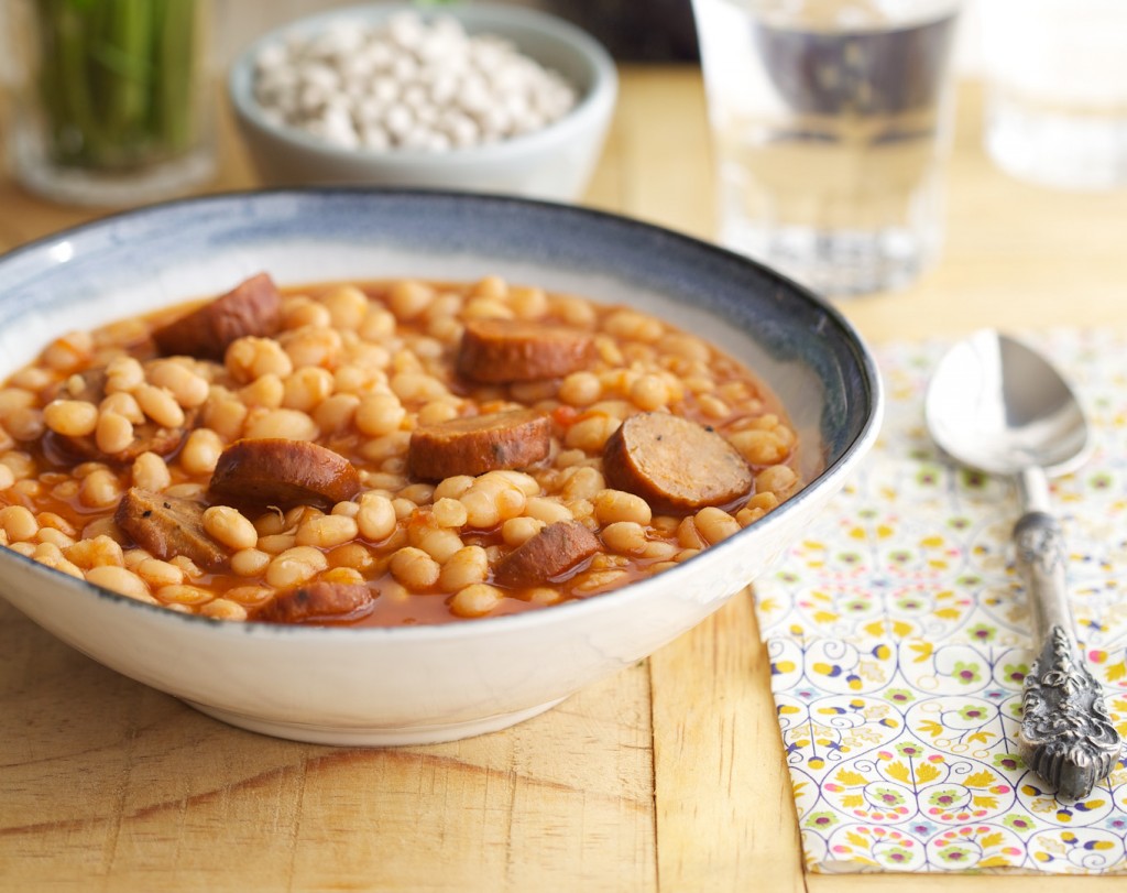 White beans and sausage have been a favorite combination of mine since I was a kid. My Mom would put a big pot on the stove early in the morning; when I’d return from school the scent wafting through the house said 'home' to me.