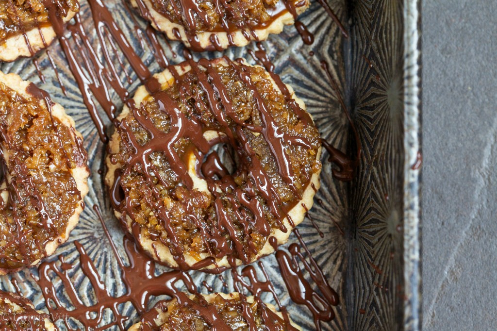 Homemade Samoas - a grain-free shortbread cookie topped with homemade caramel, toasted coconut and drizzled in chocolate.