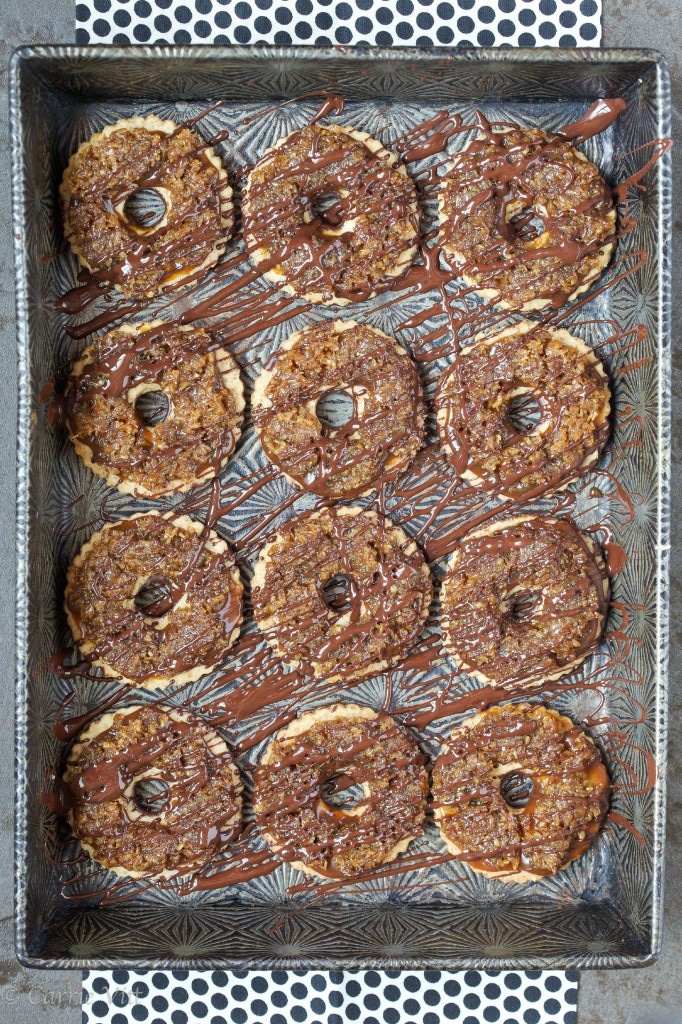 Homemade Samoas - a grain-free shortbread cookie topped with homemade caramel, toasted coconut and drizzled in chocolate.