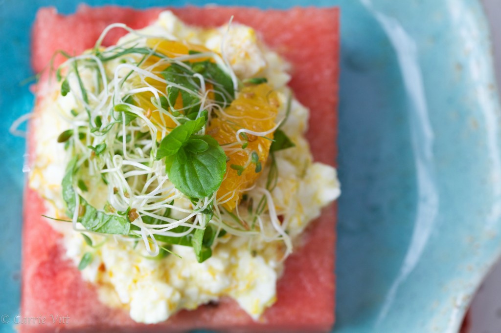 The feta is tossed with citrus zest, chili flakes and olive oil, baked until just golden brown on top, and then placed on a thick piece of watermelon. A small salad tossed with citrus juices and balsamic vinegar finishes the dish.