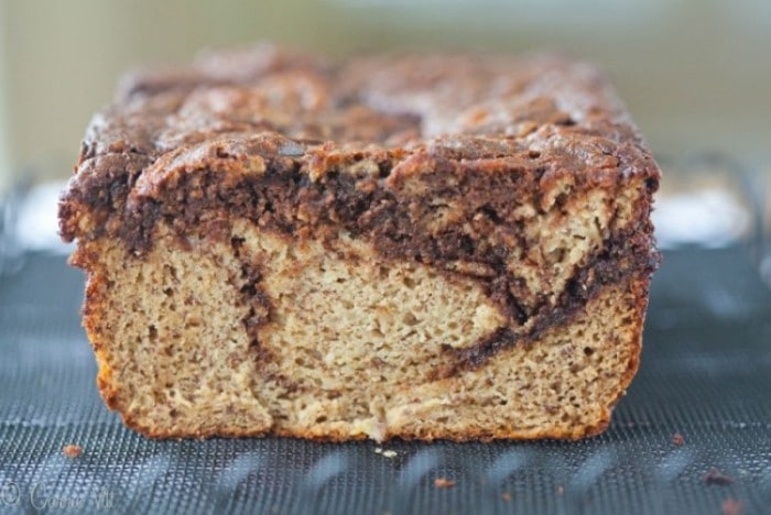 This chocolate swirl paleo banana bread recipe is easy to make and supports many creative variations. You can omit the chocolate swirl and stir in nuts, berries or dried fruit. It makes for a great breakfast or mid-day snack.