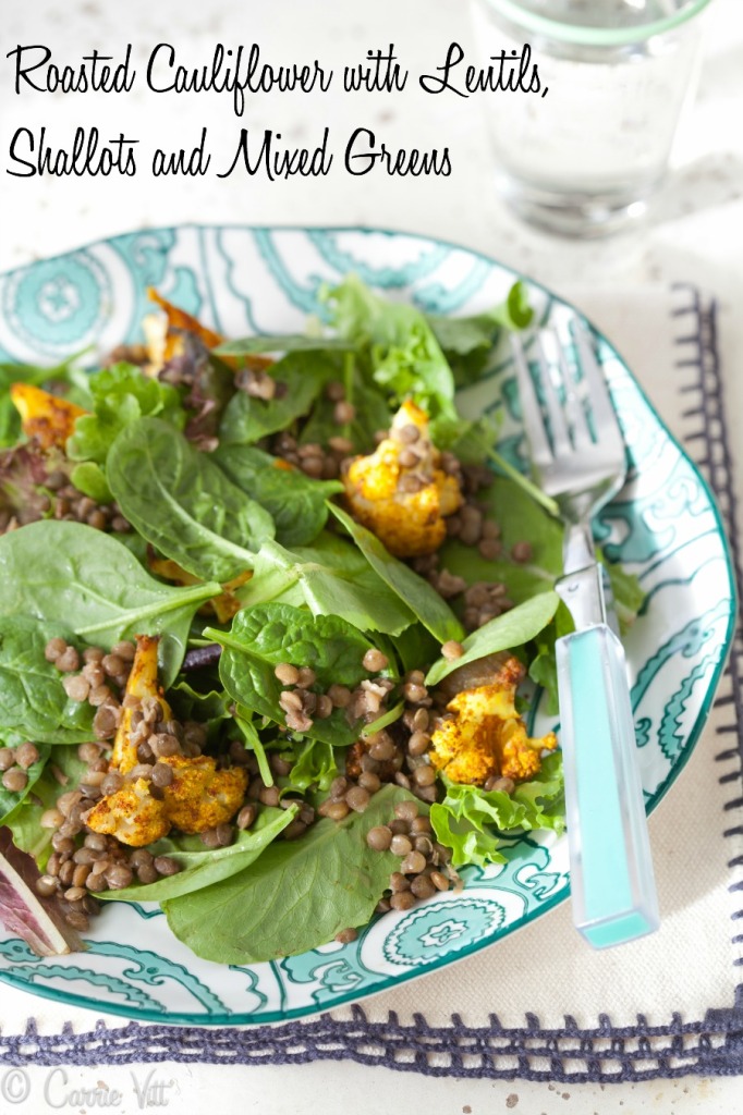 Roasted and spiced cauliflower and shallots are roasted and mixed with lentils, and mixed greens to make this delicious salad!