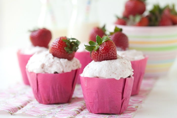 Chocolate cupcakes with strawberry frosting are quite the indulgence and are fun to make when strawberries are in season.