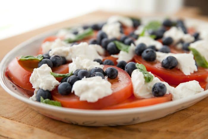 This tomato salad makes a great compliment to grilled meats or fish for a delicious weeknight dinner or when you're at your next party!